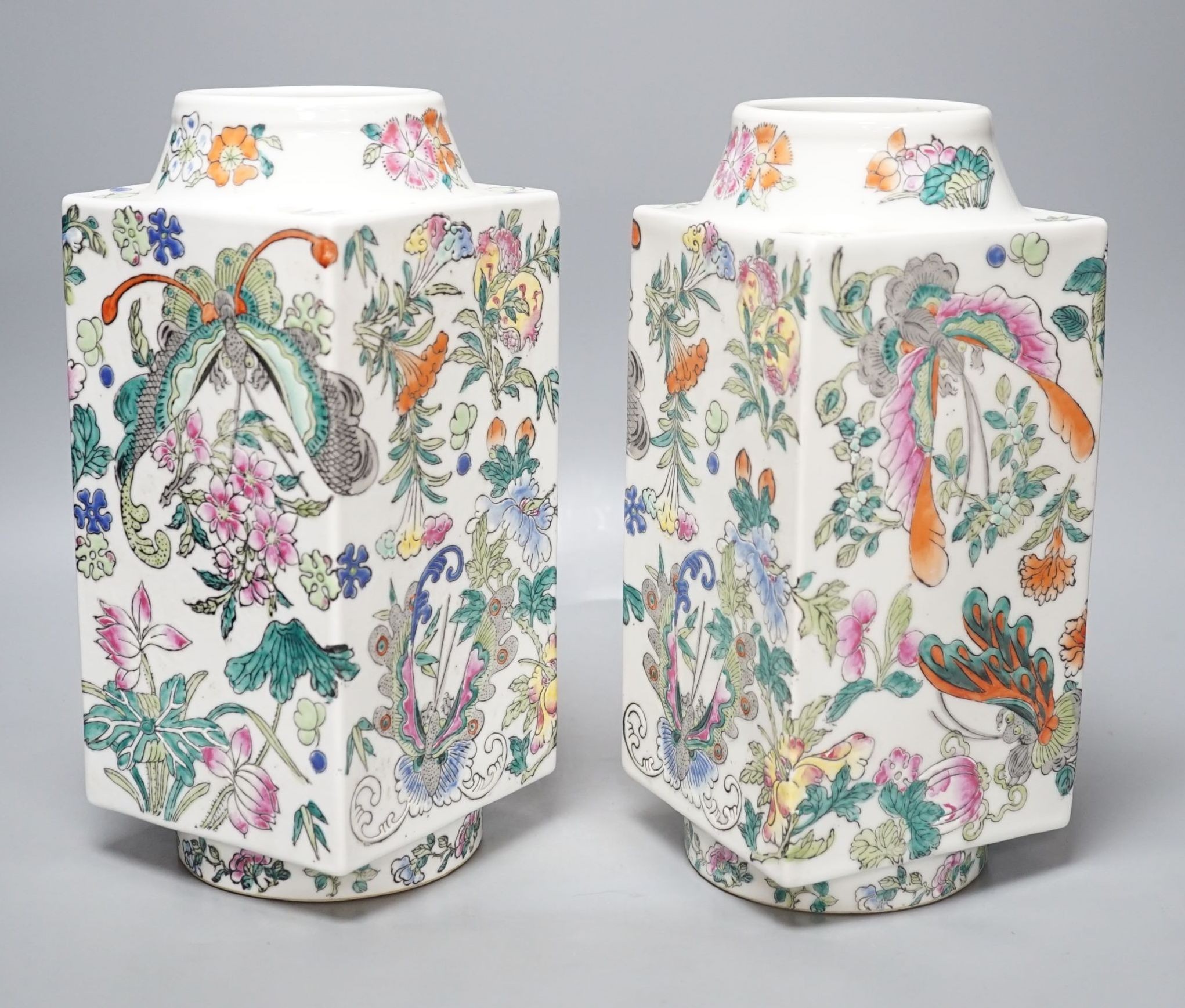 A pair of Chinese famille rose cong shaped vases, 28cms high.